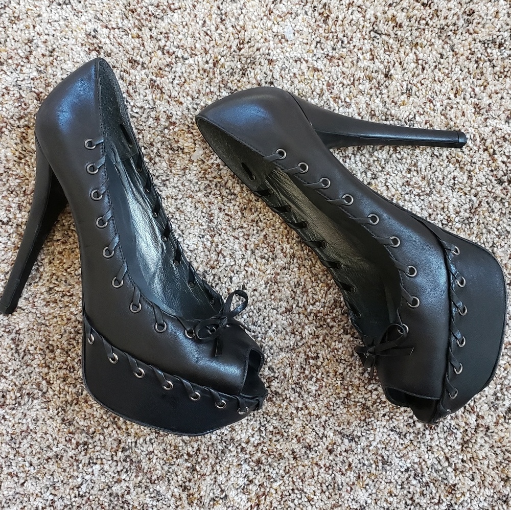 Stuart Weitzman Black Stitch Grommet Bow Stilettos